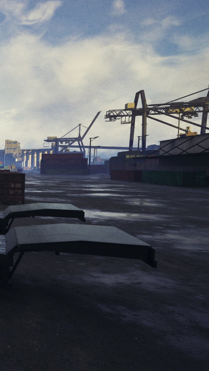 Workers manage containers at a busy shipping dock during the afternoon hours