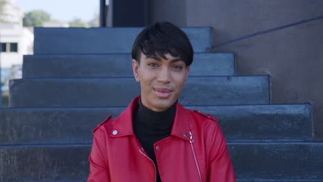 transgender adult smiling at the camera