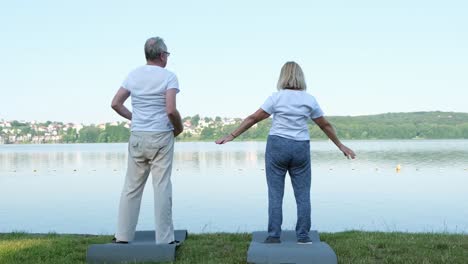 caucasian mature couple doing yoga supporting each other connection love and relationships caucasian mature couple doing yoga supporting each other connection love and relationships