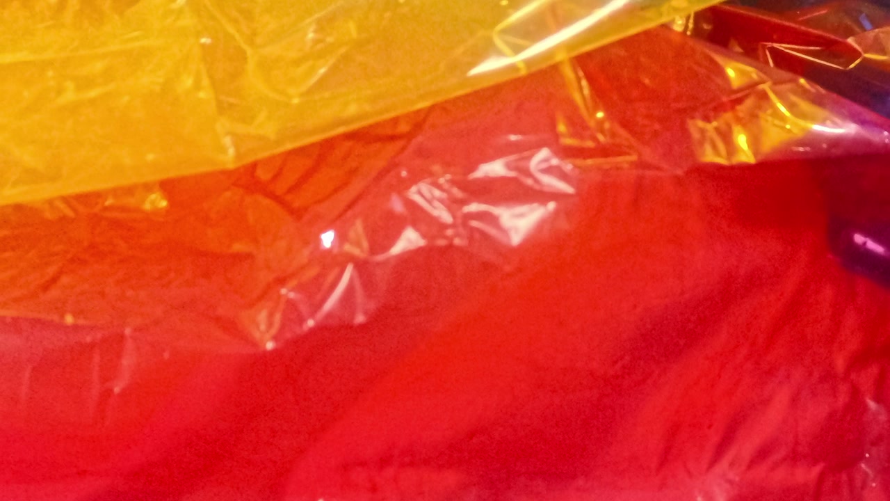 Colorful crumpled plastic sheets background