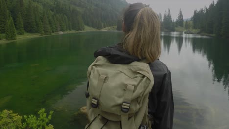 sport holiday maker woman go hiking near a green lake