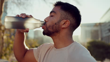 Sports,-man-and-drinking-water-in-city
