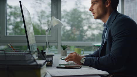 Closeup-manager-hands-typing-computer-keyboard.-Pensive-analyst-writing-report