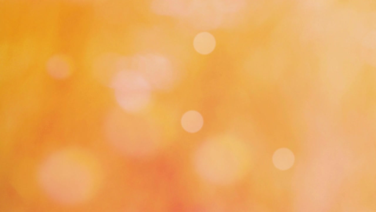 색 보케와 밝은 오렌지색 배경
