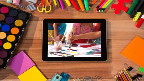 animation of a digital tablet showing multi-ethnic group of children