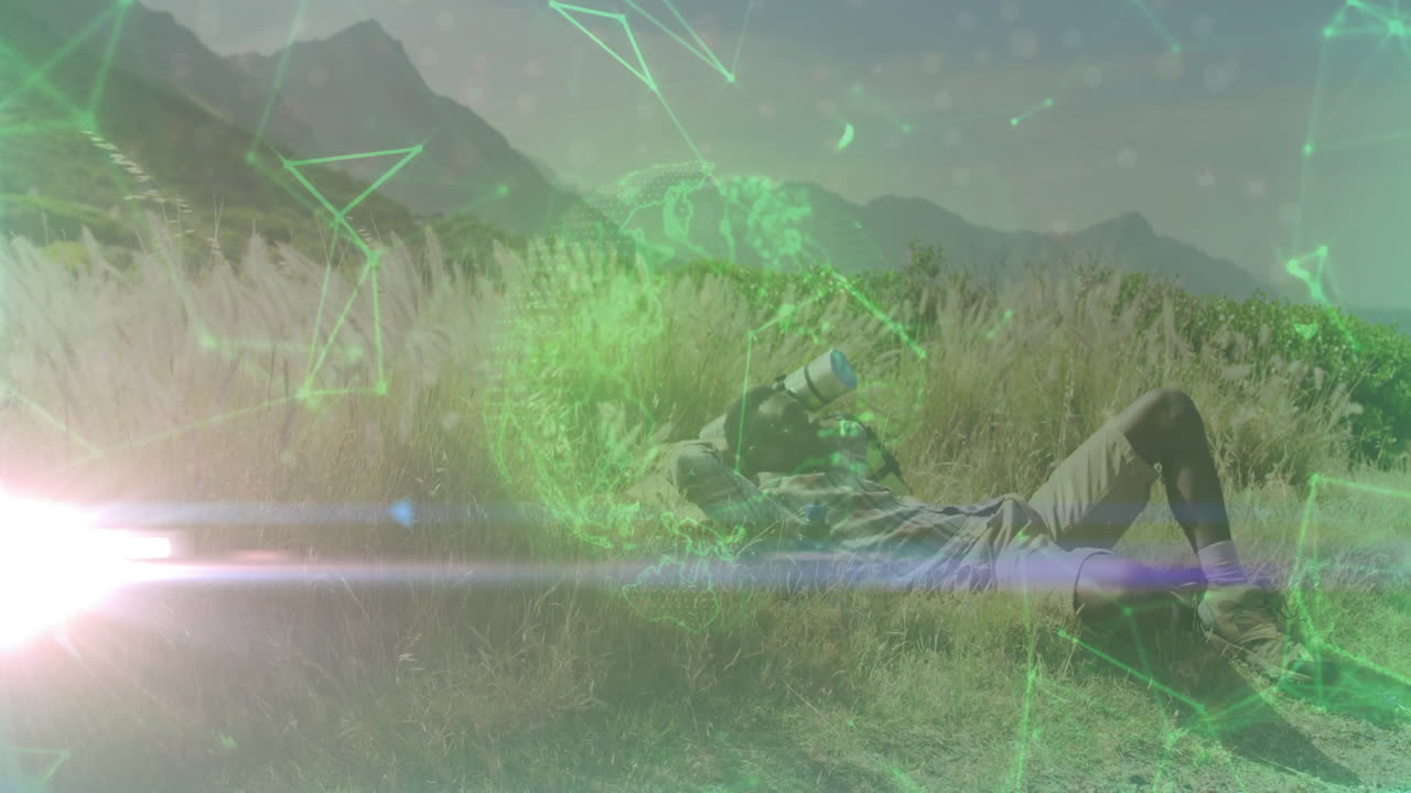 Outdoor photographer lying in meadow using telephoto lens scanning sky with digital technology grid