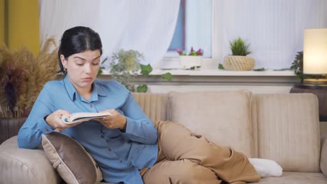 young woman lying on the sofa is resting.