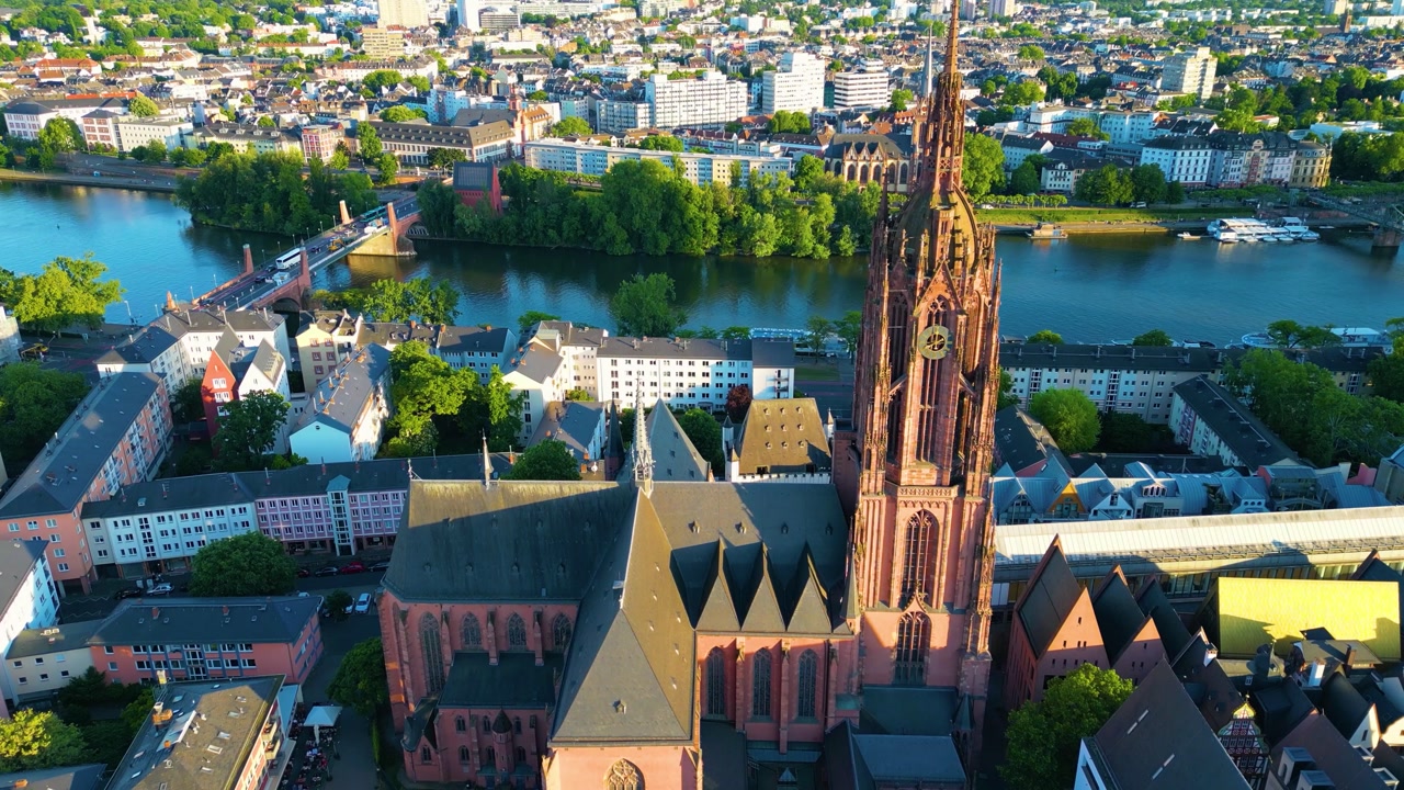 4K Drone Video of the Gothic-Style Kaiserdom St. Bartholomäus Cathedral and Evangelische Dreikönigskirche Church on the Main River in Downtown Frankfurt, Germany (High Speed)