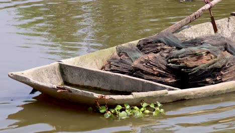 an old boat floating on a canal