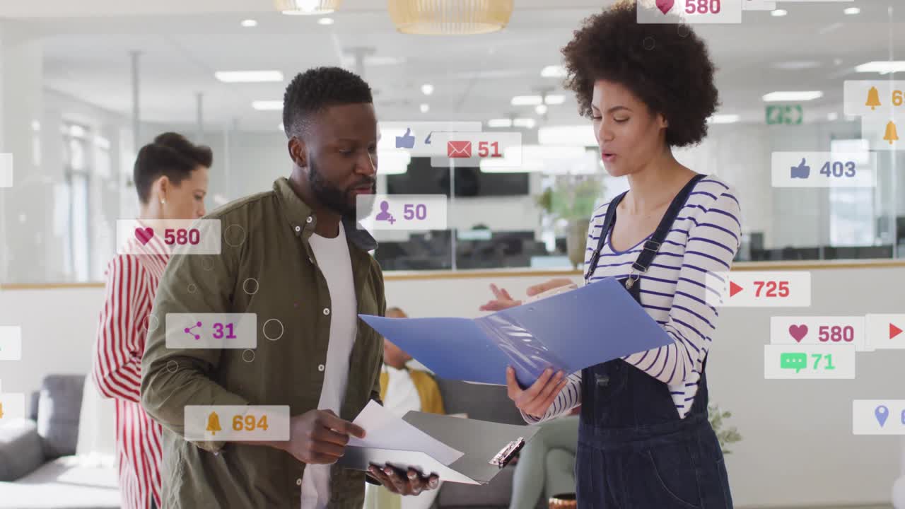 Business collaborators reviewing docs at table, opening blue folder animating icons rising