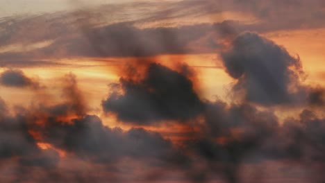 Beautiful-dramatic-sunset-with-cloudy-orange-sky-and-grass-foreground