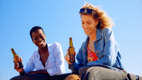 female friends having beer in the car 4k