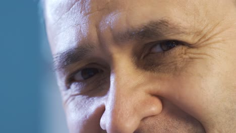 Close-up-eyes-of-happy-and-cheerful-man.