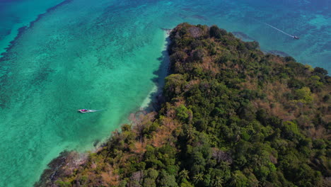 exotic island covered by lush vegetation in the indian ocean