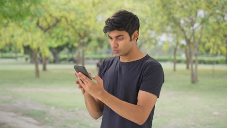 Angry-Indian-boy-chatting-with-someone