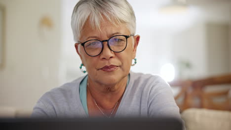 senior woman, home and laptop with face