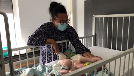 mom being worried about her baby who's sick in hospital.
