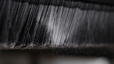close-up of a brush with black bristles