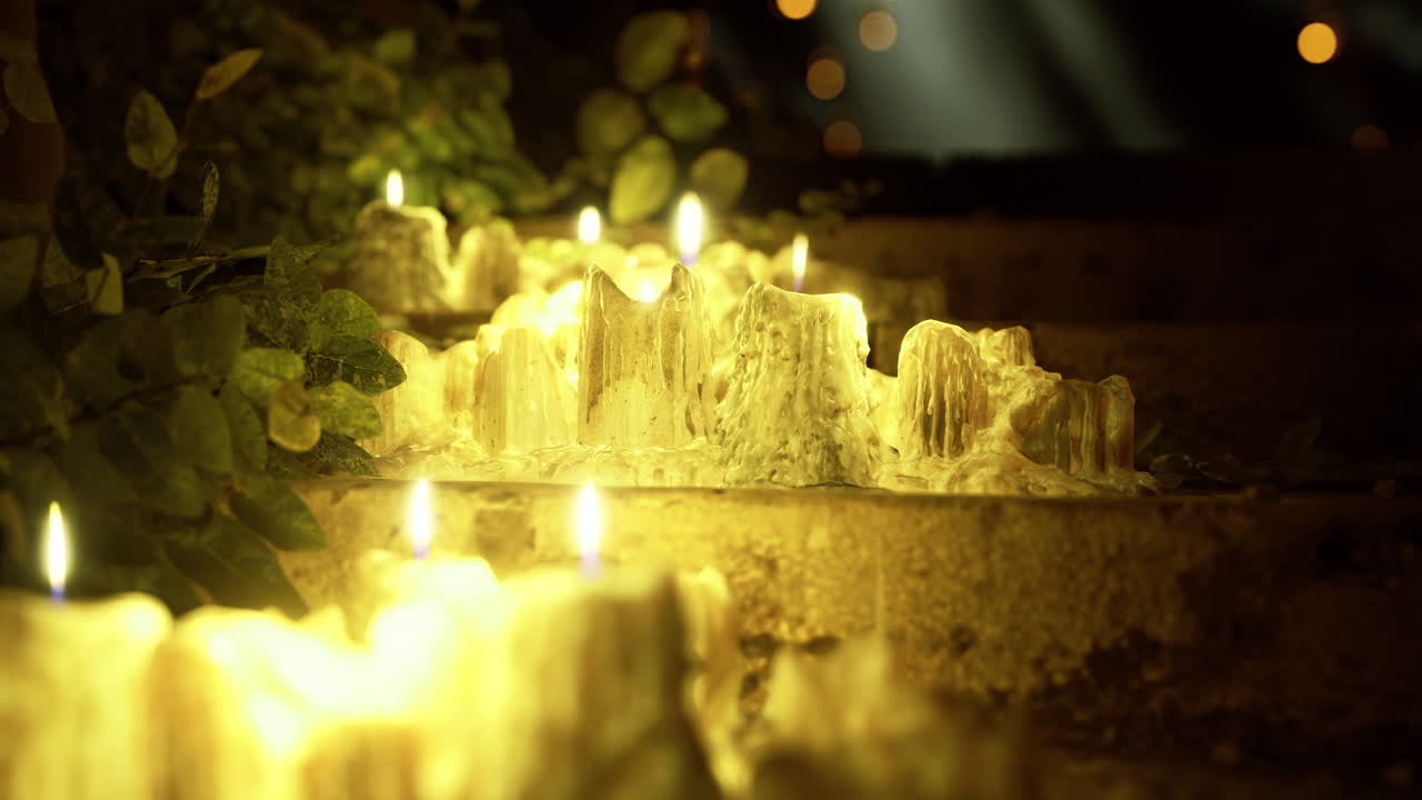 Warm glow of candles illuminating a tranquil outdoor staircase at night