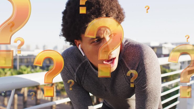 Animation of question mark symbols over tired biracial athlete standing with hands on knees