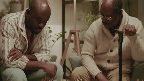 Black-men-playing-chess-in-the-living-room