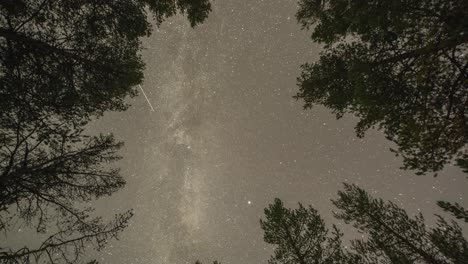 The-Milky-Way,-twinkling-stars,-and-wispy-clouds-in-the-night-sky