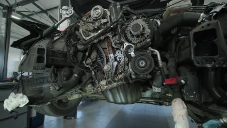 disassembled car engine in repair shop