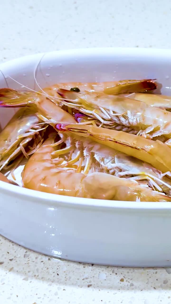 Prawns arranged in a bowl for cooking