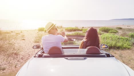 couple enjoying a scenic beach road trip