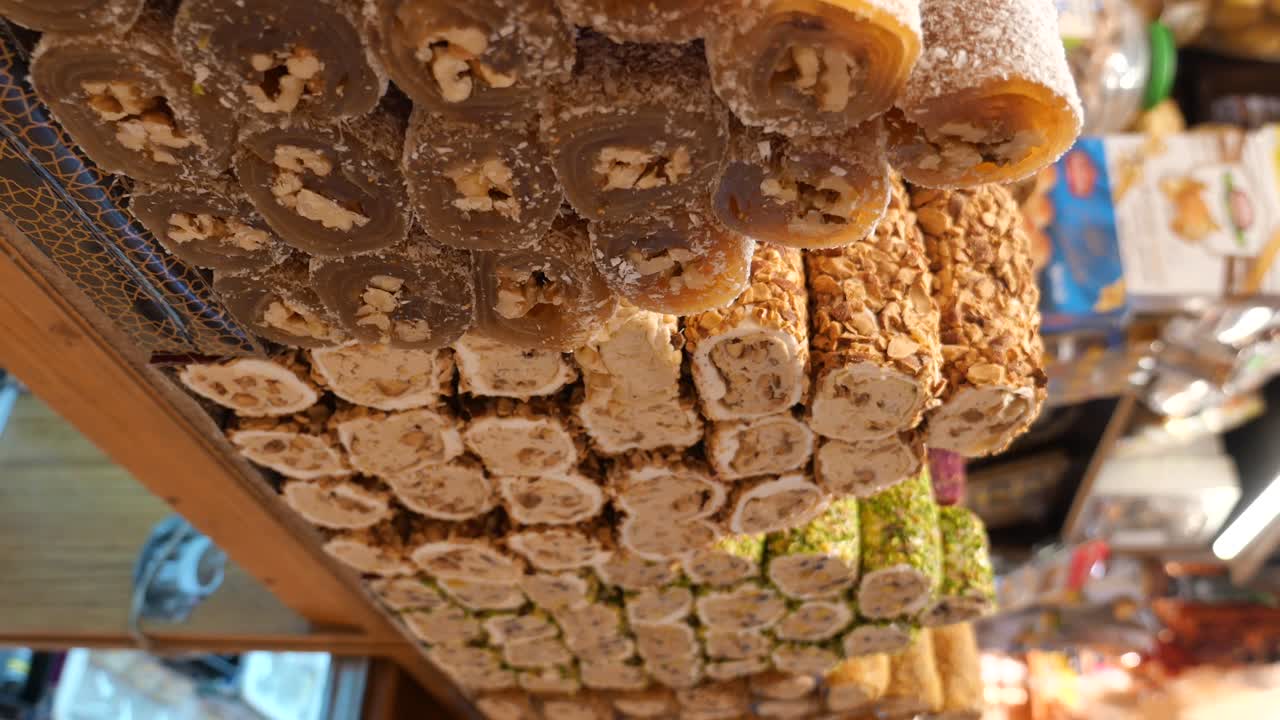 Rows of assorted Turkish delight with nuts in a market