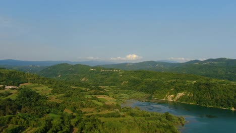 lake butoniga water dam in croatia left pan revealing nearby hills, aerial drone left pan reveal shot