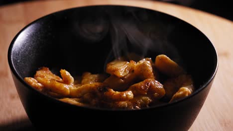 smoking hot chicken in bowl: cooking noodles, chicken, and vegetables