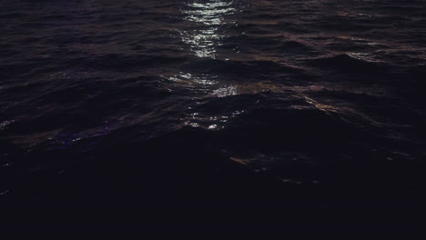 dark blue ocean waves at night