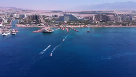 aerial view of eilat city and coastline with boats on the red sea