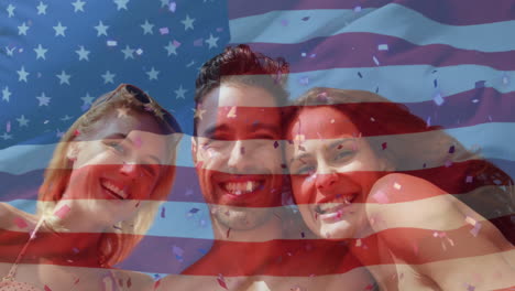 Animation-of-flag-of-usa-over-caucasian-friends-on-beach-in-summer