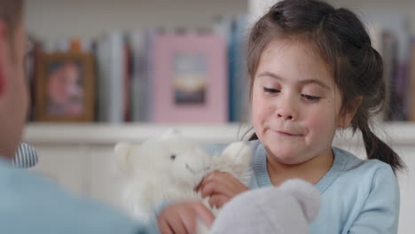 father and daughter playing with teddy bear toys at home little girl having fun enjoying playful game with dad 4k footage