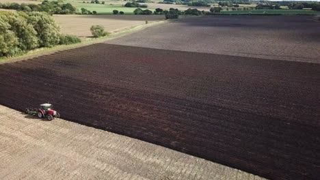 Aerial-footage-over-tractor-ploughing-field