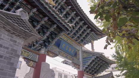 ancient traditional chinese gate paifang arch in village in yunnan, china