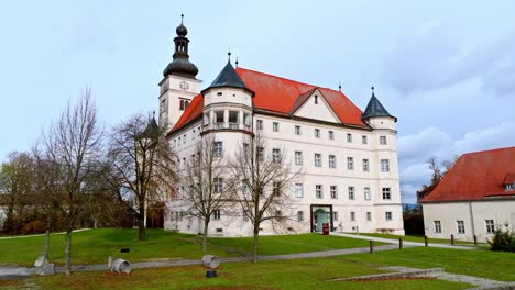 schloss hartheim in scenic landscape of austria - aerial drone shot