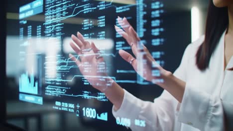 woman interacting with a futuristic digital display
