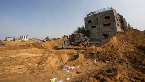 israeli d9r armoured bulldozer makes roads and clears debris for ground offensive