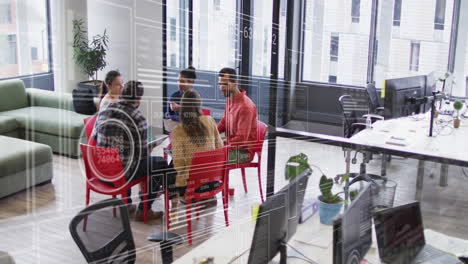 animation of interface against over head view of diverse colleagues discussing at office