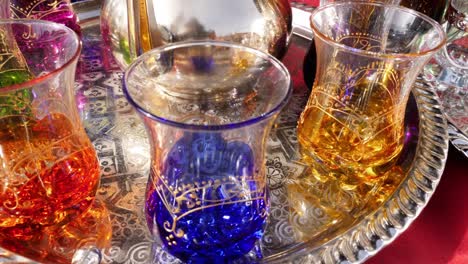 colorful traditional moroccan tea glasses in a bazaar in the medina of marrakesh (marrakech), morocco.