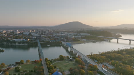 sped up aerial footage in reverse that goes across the tennessee river and showing lookout mountain behind downtown chattanooga, tn