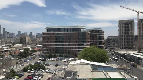 Modern-hotel-in-the-middle-of-the-city-of-Tel-Aviv,-Israel,-aerial