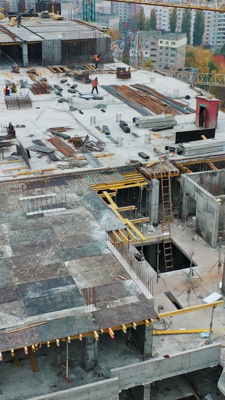 Construction of a residential apartment complex. Aerial view. Vertical video
