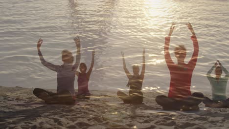 animation of glowing light over senior women practicing yoga by seaside