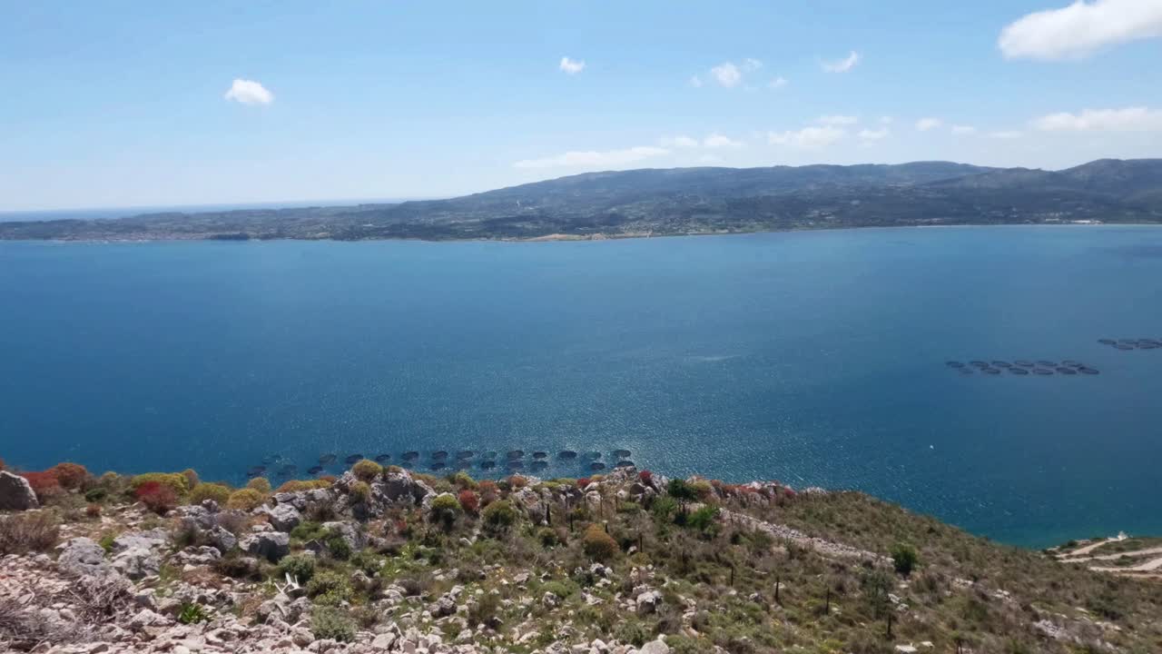 Aerial view of Ionian sea Kefalonia Greece with Fish farm sea pens in blue waters