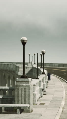 a street with a bridge and a bench