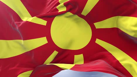 republic of macedonia flag waving at wind in slow in blue sky, loop